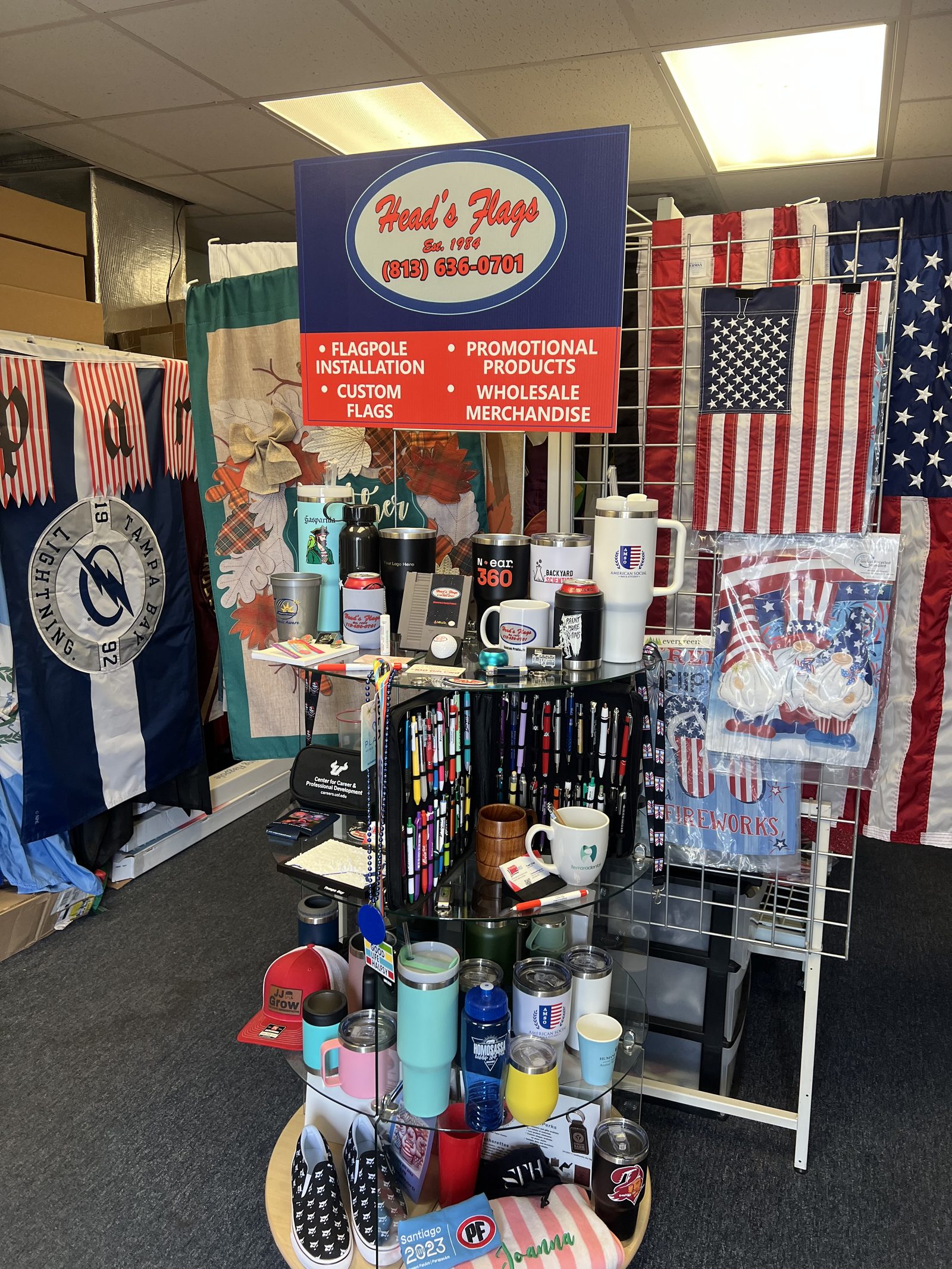 Flags and promotional products on display inside the shop