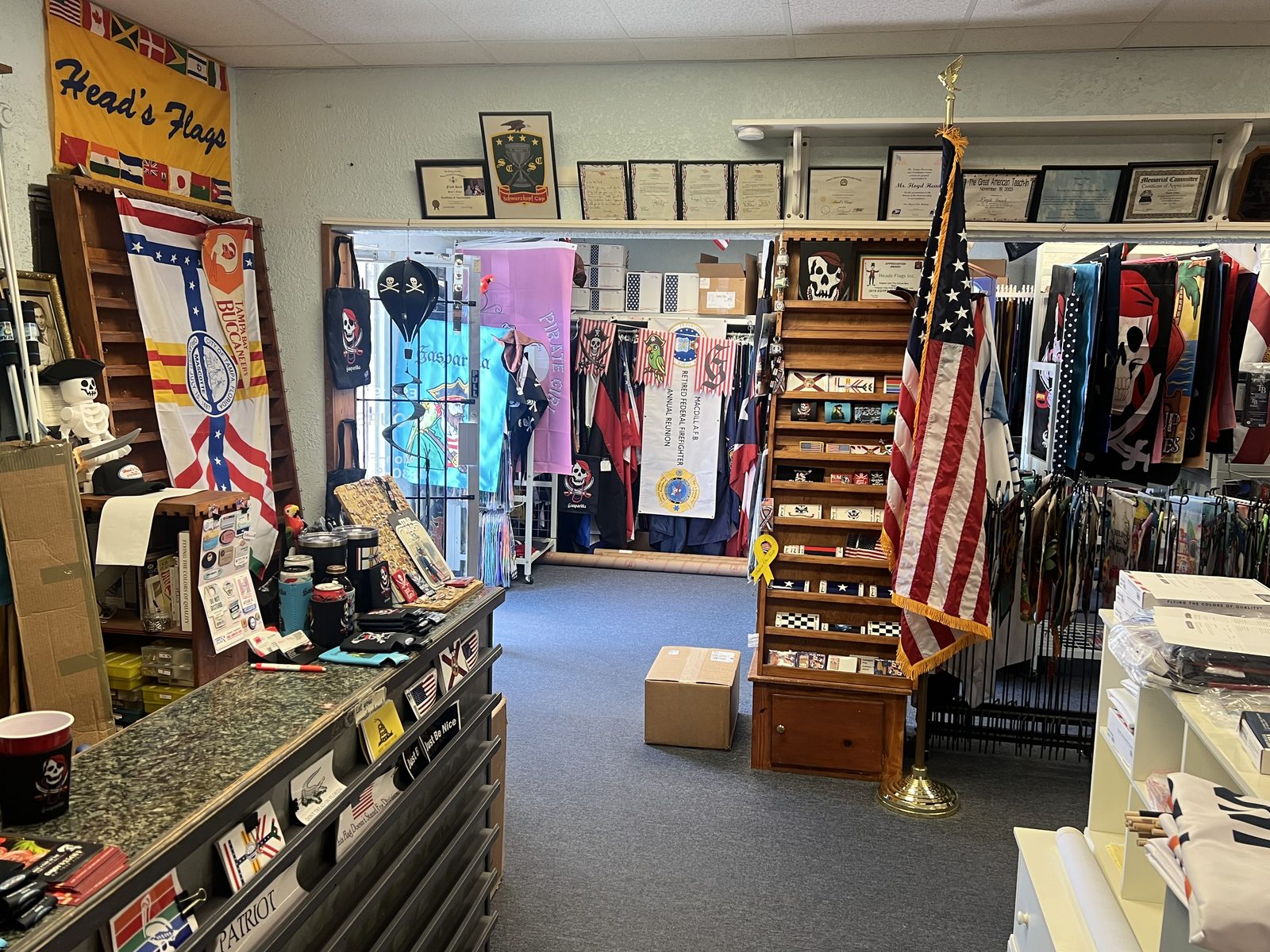 Inside the Head's Flags shop on Henderson Blvd, with flags of every nation and state on the racks