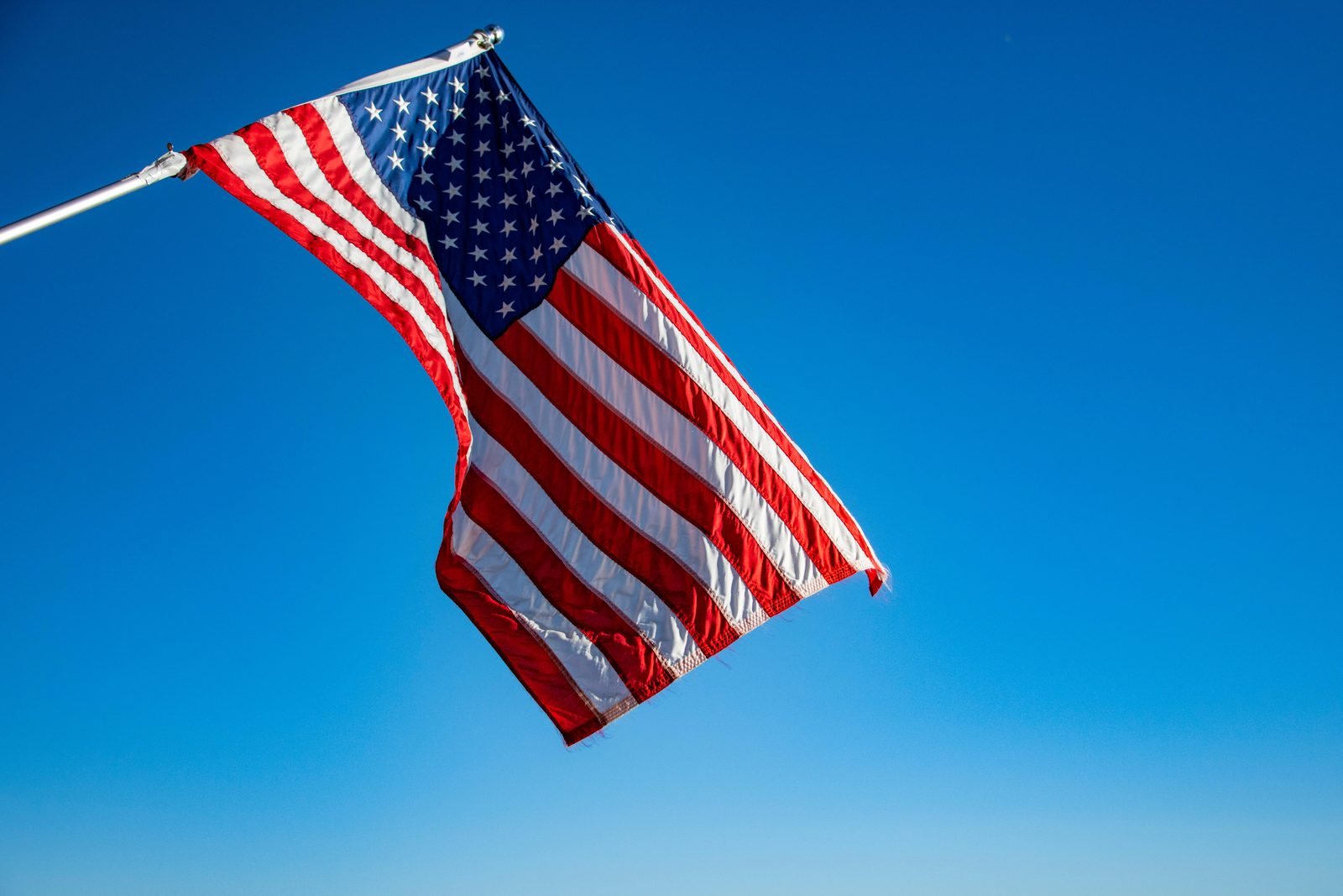 American flag against a blue sky